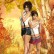 Short woman standing with hands together and pointing up like a gun, tall woman with hand on lips. Yellow autumn background.